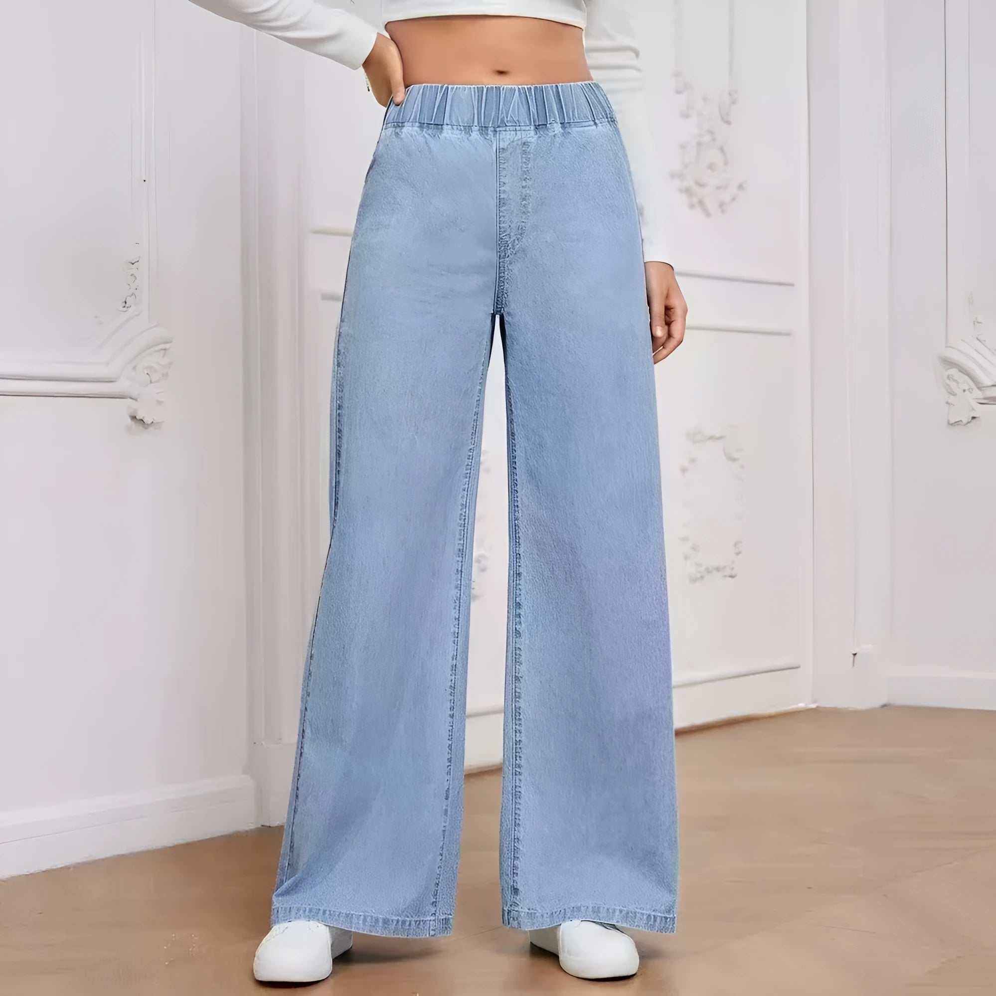 Light blue washed wide-leg plus size straight jeans with mid waist zip fly