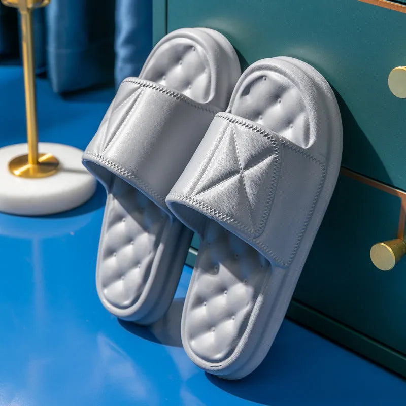A pair of thick-soled EVA bathroom slippers in a choice of colours, showing non-slip sole texture.