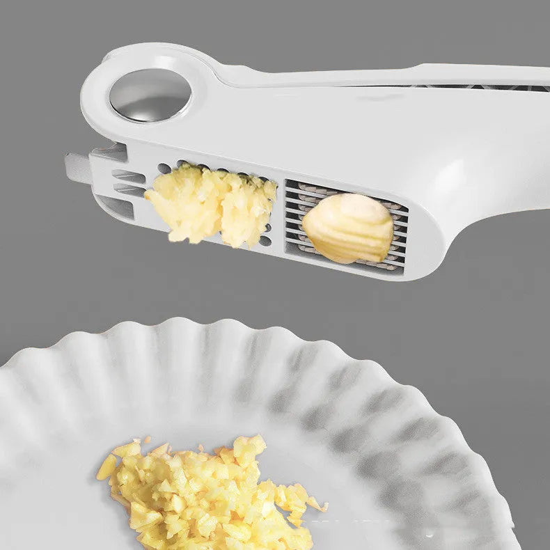 Manual garlic press in white, green, or orange with stainless steel plate and ABS handle.