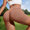 Women's seamless high-waist yoga shorts in solid colour on mannequin.