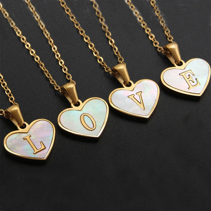 A personalized heart-shaped necklace with a 26-letter charm, crafted from high-quality stainless steel and gold plating.