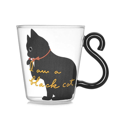 Adorable cat-shaped glass mug with a playful cat tail handle, perfect for coffee, tea, and juice lovers