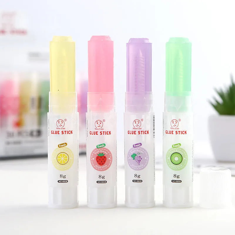 Jelly fruit fragrance solid glue stick in random colour, 8.5cm long, for students and crafts.