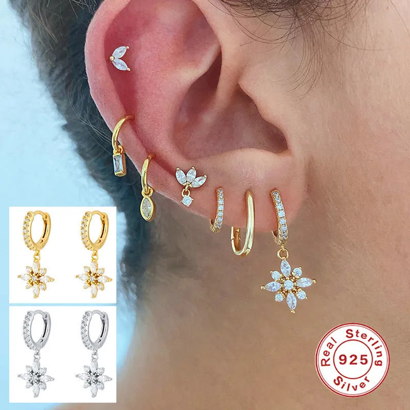 Sterling silver snowflake pendant earrings with geometric design and gemstone accents
