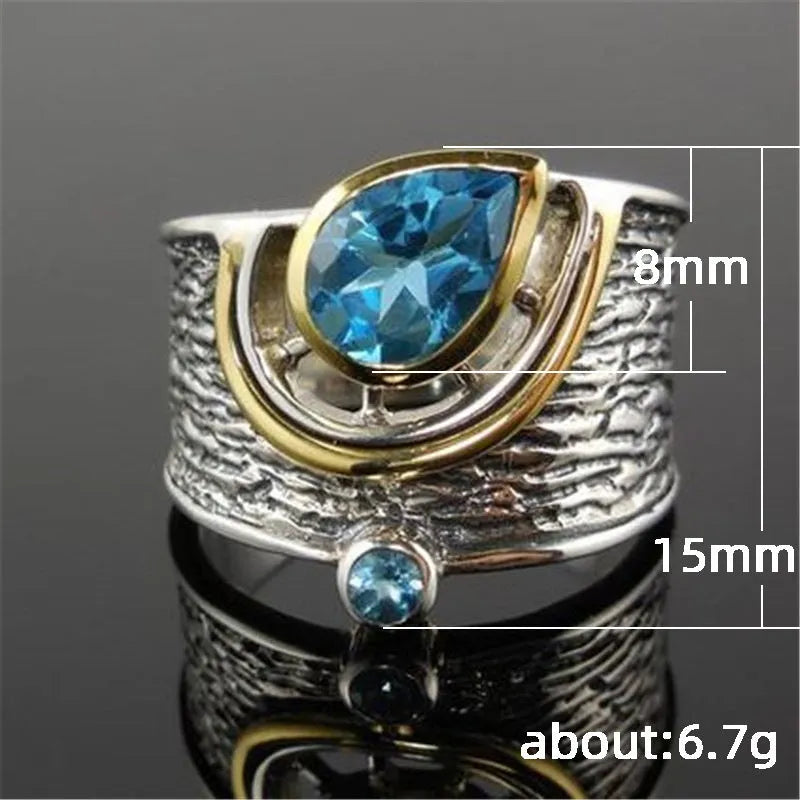 Blue rhinestone zircon ring with a Chinese style drop shape on an alloy band.