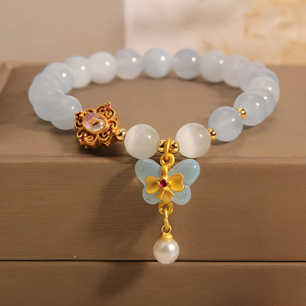 Crystal bracelet with aquamarine butterfly pendant and rhinestone details for women