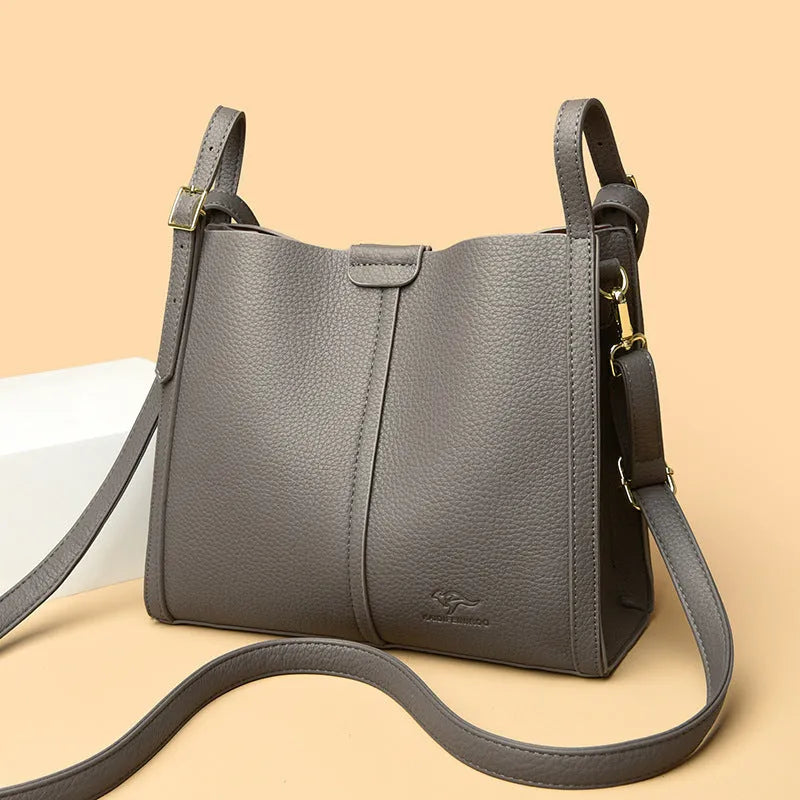 Brown PU women's shoulder bag with single strap and multiple interior compartments