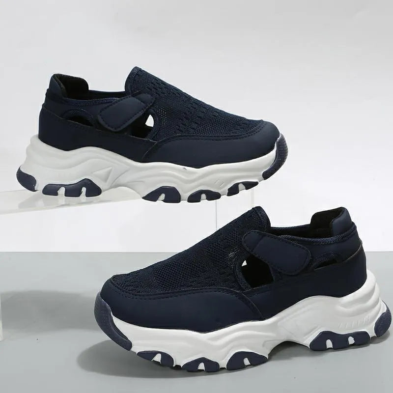 Women's mesh sport shoes with round toe, low heel, and Velcro fastening in a solid colour