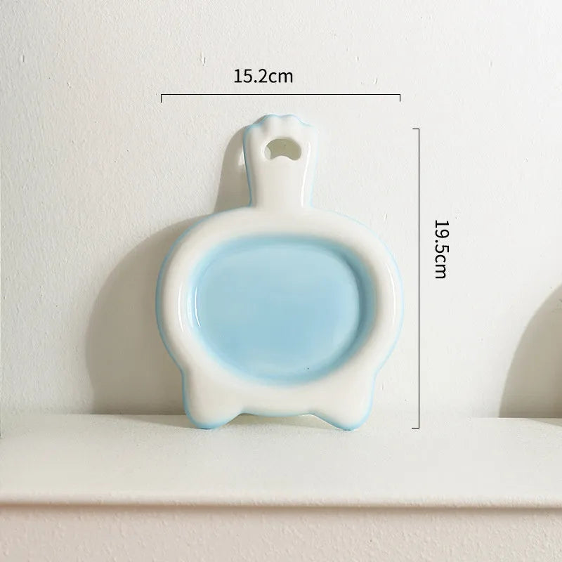 Ceramic cat bowl in blue, green, pink, or yellow colour with a shallow mouth design for pet food and water.