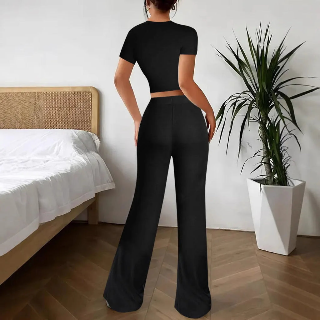 Black high waist trousers and matching short sleeve t-shirt set on hanger