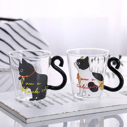 Adorable cat-shaped glass mug with a playful cat tail handle, perfect for coffee, tea, and juice lovers