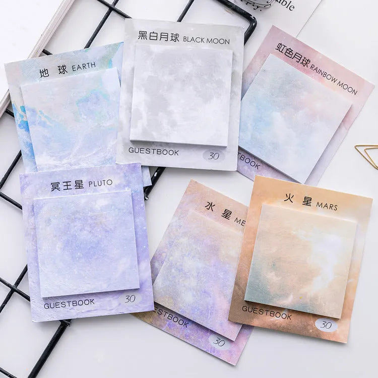 Square planet-themed sticky note notepad showing oil painting designs of moon, earth, and mars.