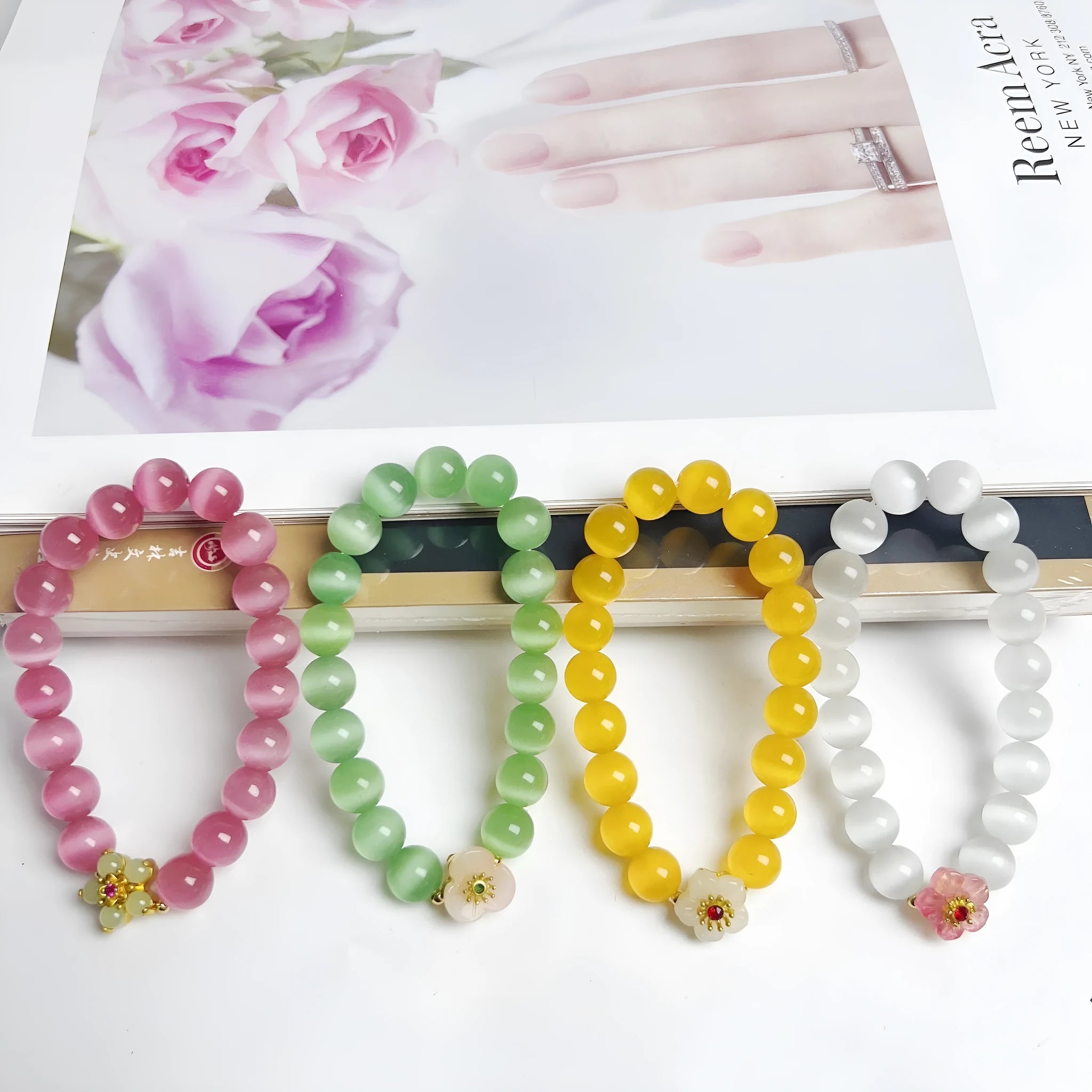 Women's handmade glass bead bracelet with floral design in green, pink, white or yellow