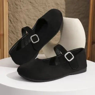 Men's solid black flat fisherman shoes with canvas upper and rubber sole on a white background.