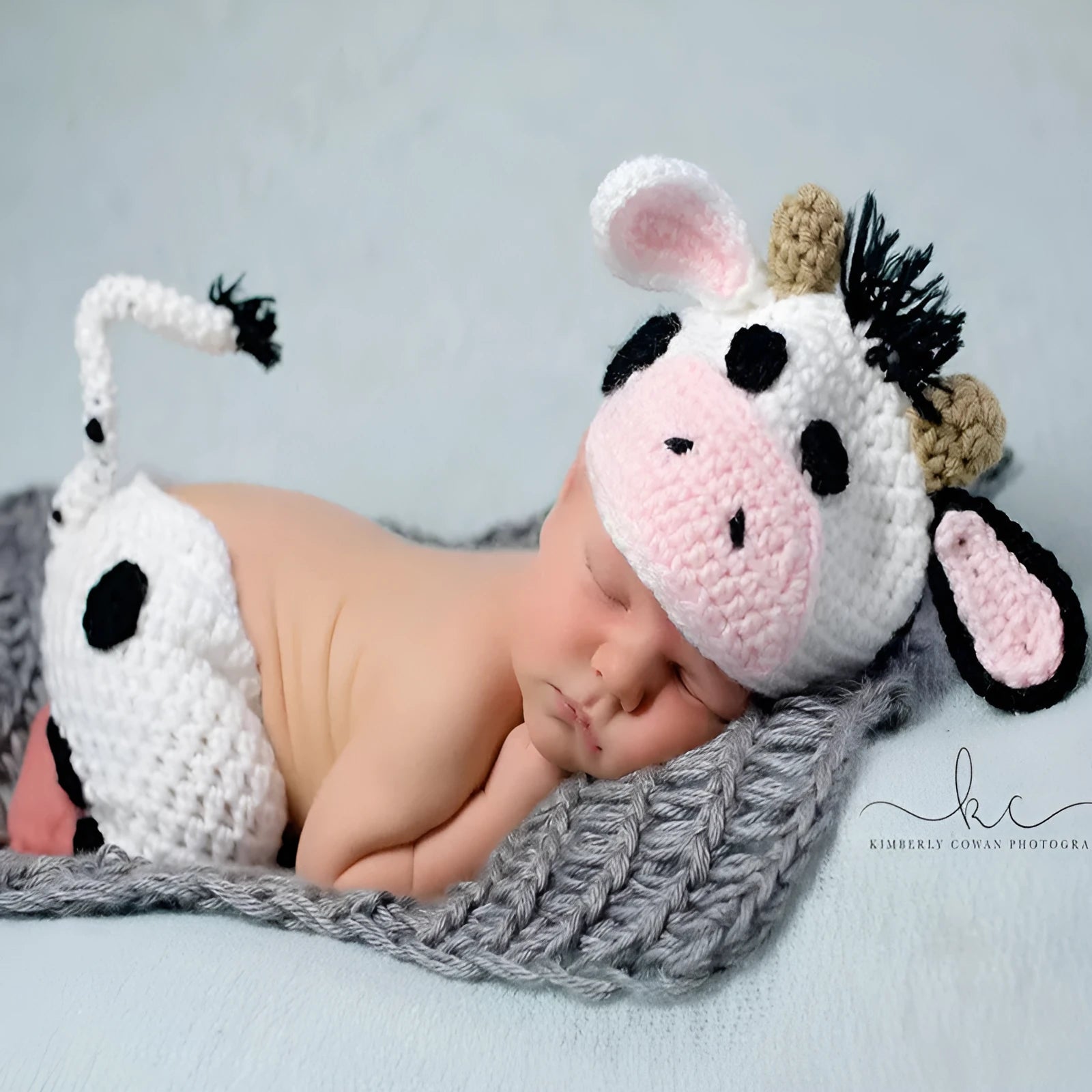 Hand-knitted white baby cow suit set with matching hat and pants for newborn infants