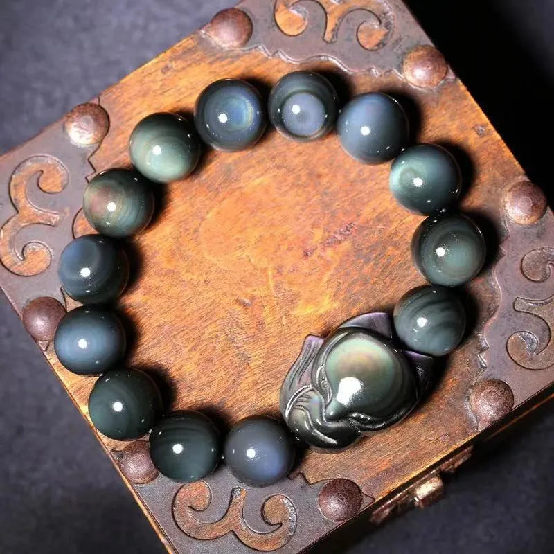 Obsidian bracelet carved with fox or zodiac animal design in cartoon style