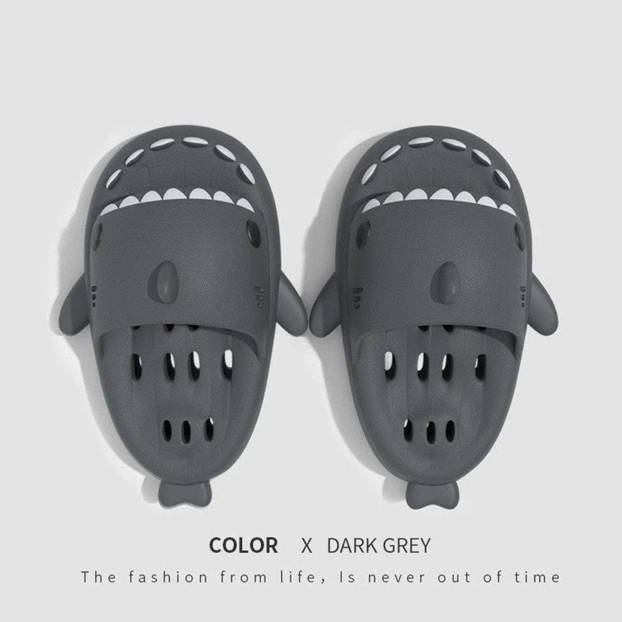 Shark-inspired shower slides with drain holes, featuring authentic shark design details and quick-drying EVA material