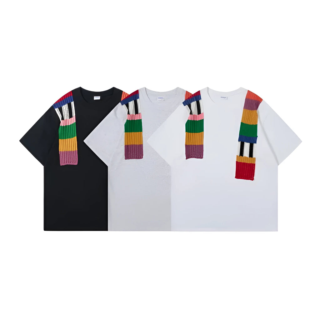 Men's loose fit grey T-shirt with a black and white patchwork letter design on the chest.
