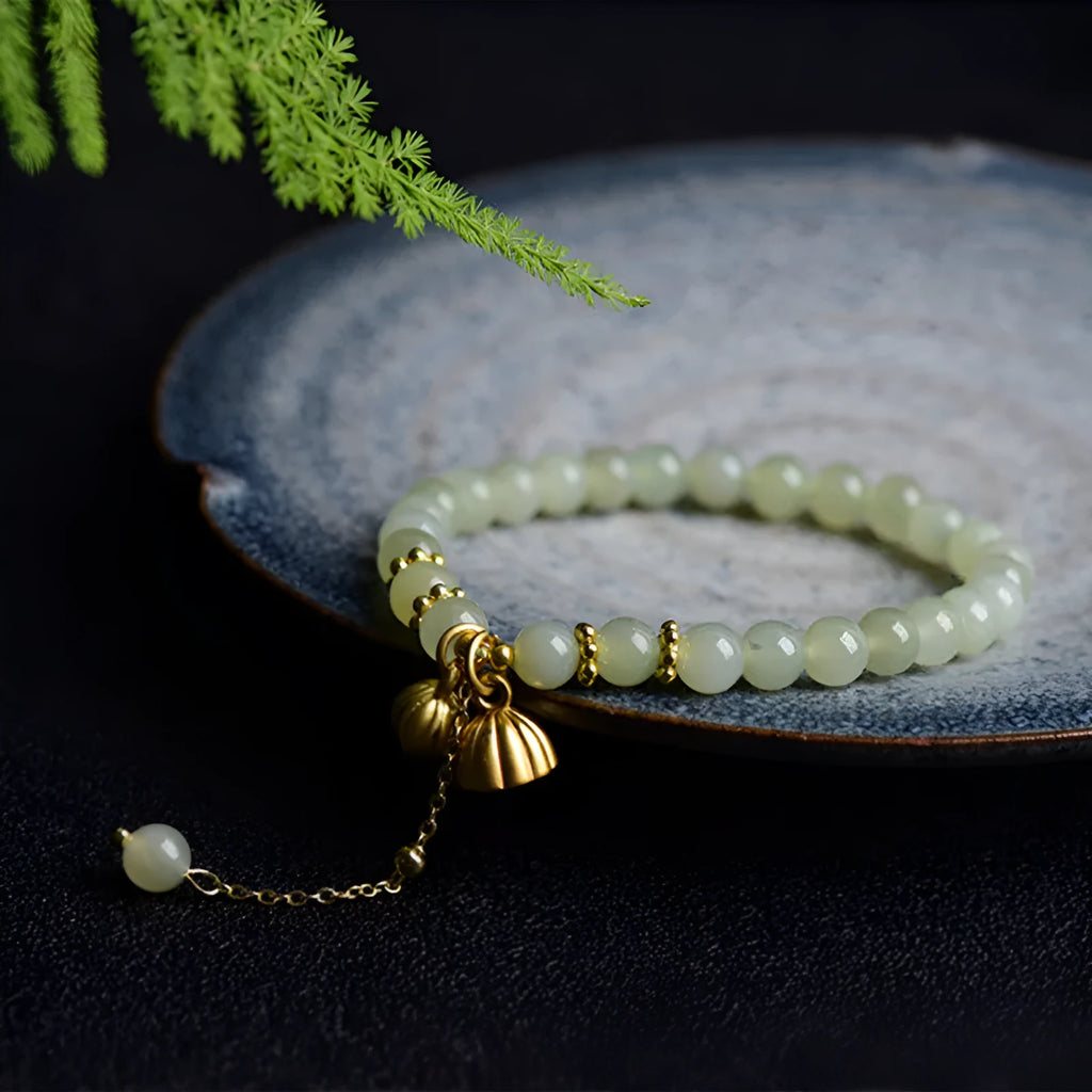 Natural Hetian jade bracelet with lotus carving and fu symbols on 6mm beads