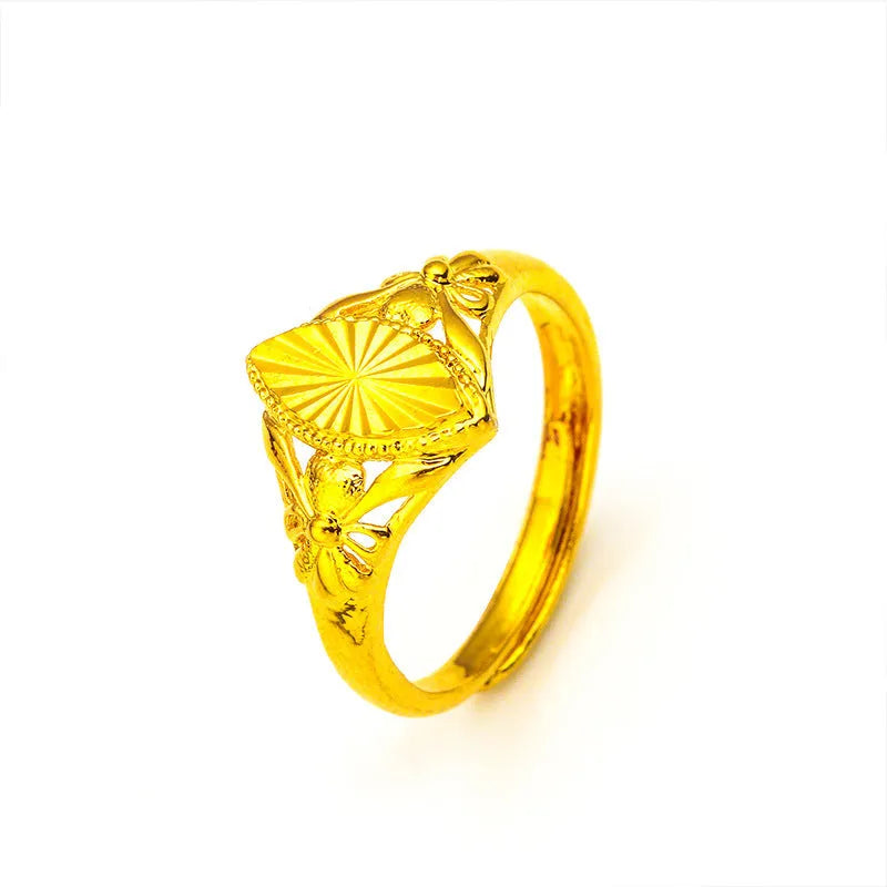 Gold coloured brass ring with open diamond flower design and geometric textured shape