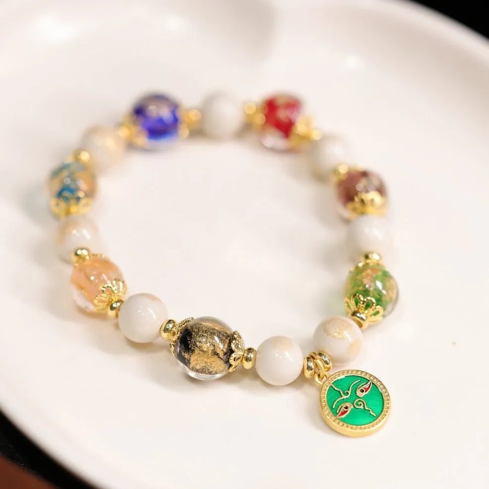 Handmade coloured glaze glass bracelet with Five Gods of Wealth geometric design in blue, green, red, white, or yellow.