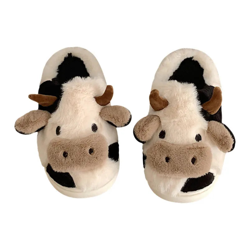 White and coffee cartoon cow slippers for women with plush faux fur and a textured non-slip sole.