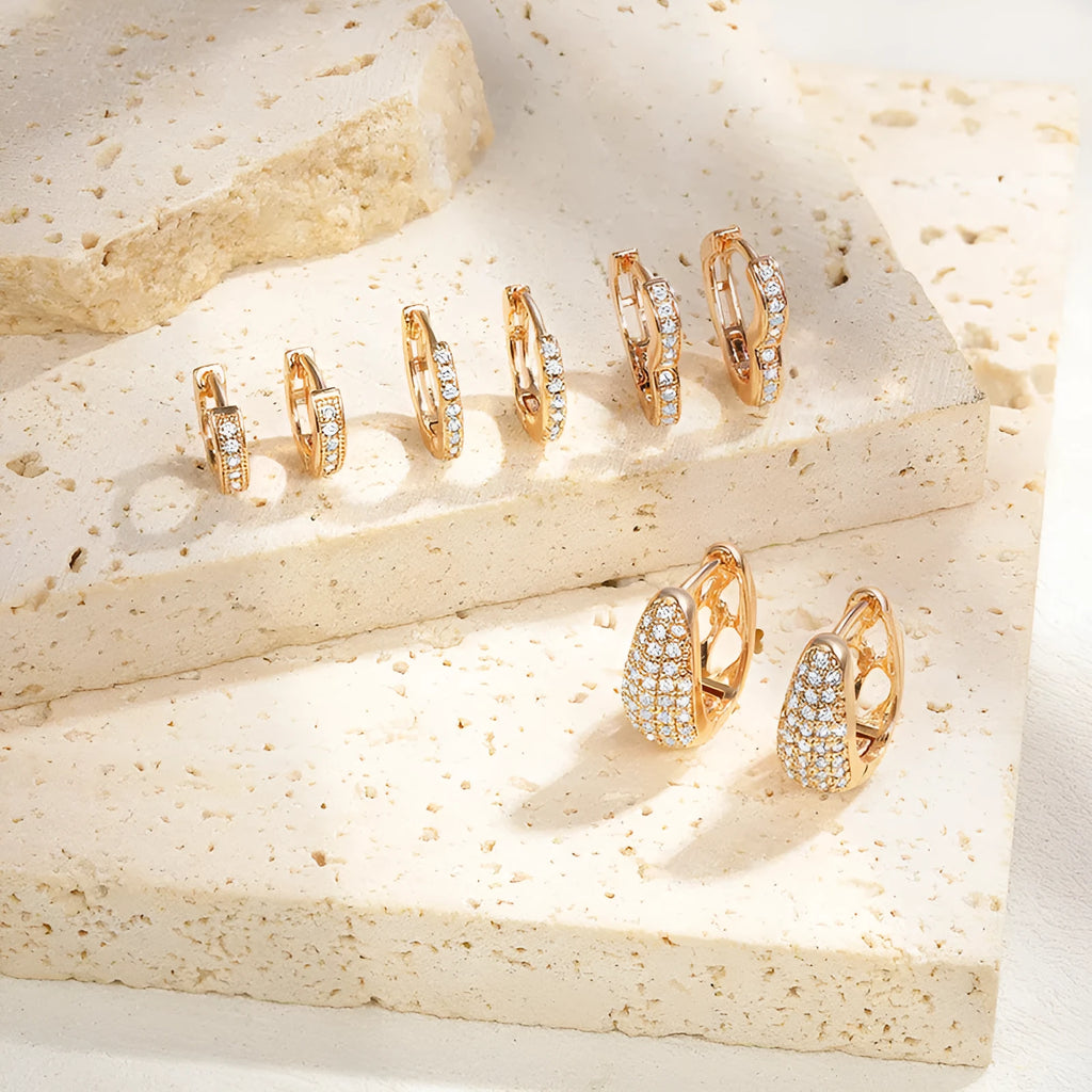 Brass gold plated heart shaped zircon clip earrings with gang drill detailing on copper base