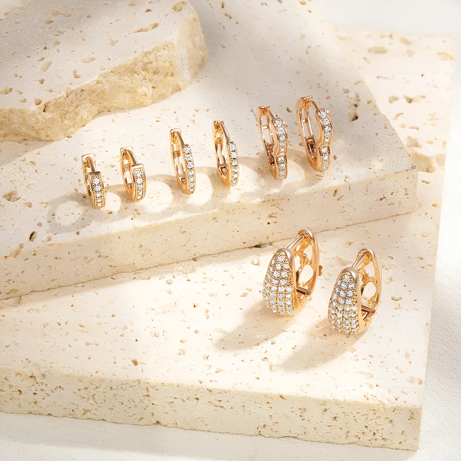 Brass gold plated heart shaped zircon clip earrings with gang drill detailing on copper base