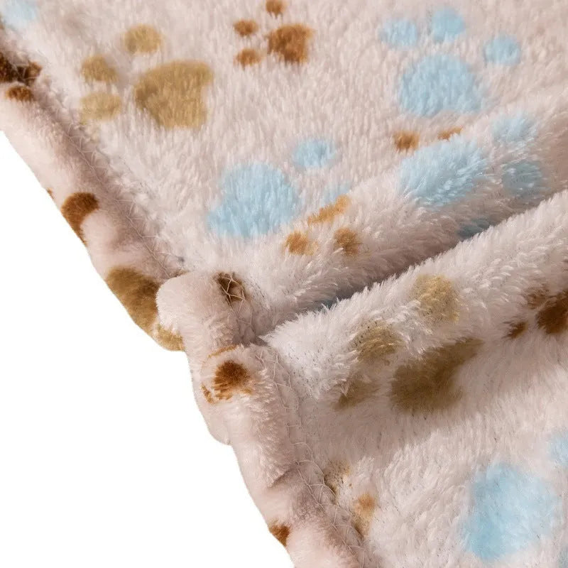 Blue cartoon dog paw pattern pet blanket showing double-sided thickened flannel texture