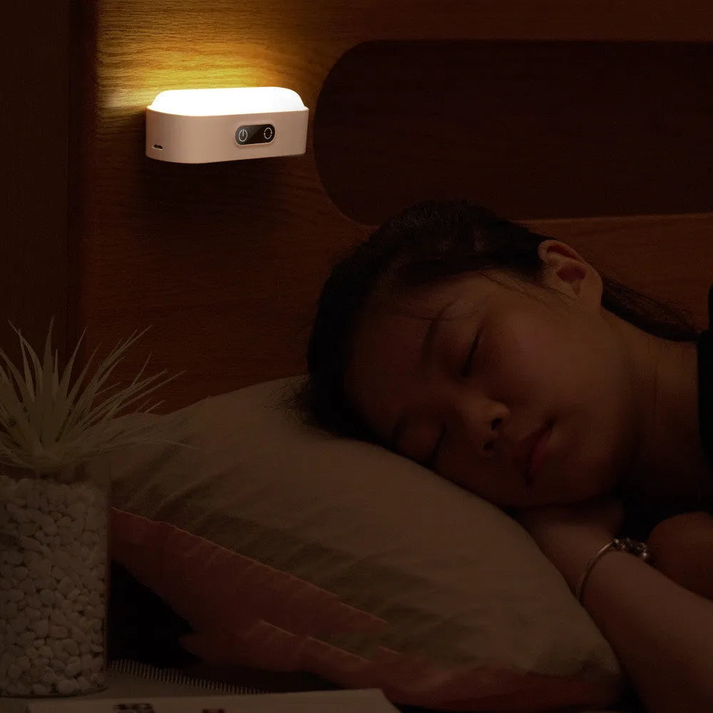 White magnetic USB rechargeable LED sensor light with touch controls on a curved panel
