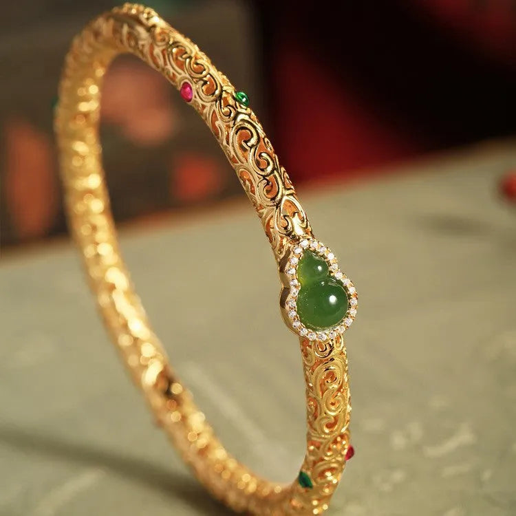 Gold-plated women's open cuff bracelet with xiangyun gourd charm on copper electroplated construction