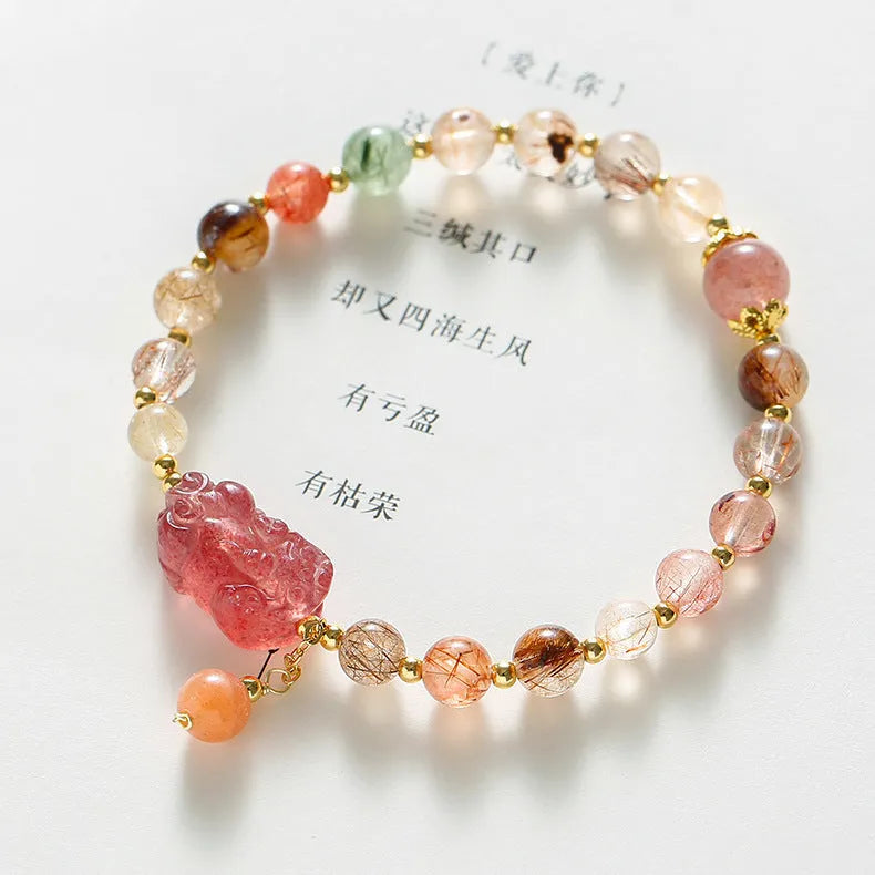 Strawberry quartz crystal bracelet with copper construction and pearl accents in dopamine crystal colour