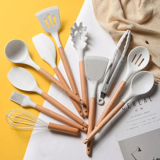 Marble-patterned silicone kitchen utensils with beechwood handles, including spatula, spoon, and tongs