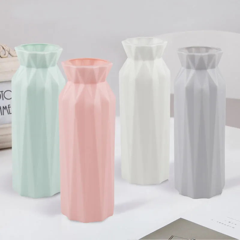 Simple green melamine plastic vase with a 7.2cm base diameter on a wooden table.