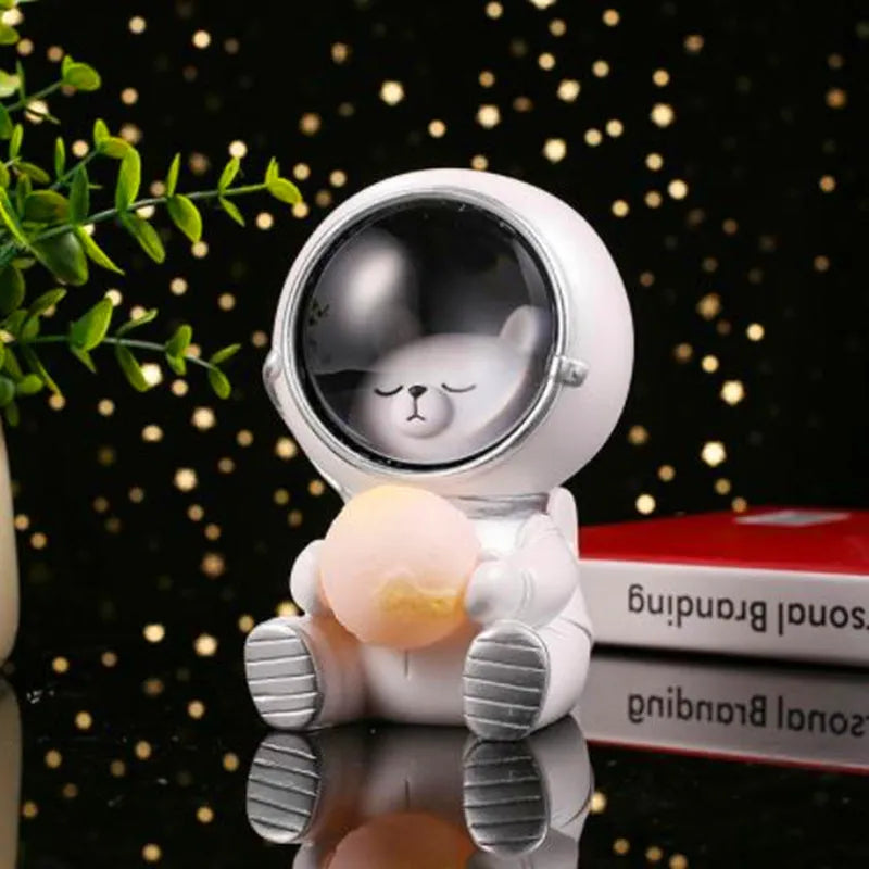 Animal-themed resin night light projecting starry sky lighting effect on surface