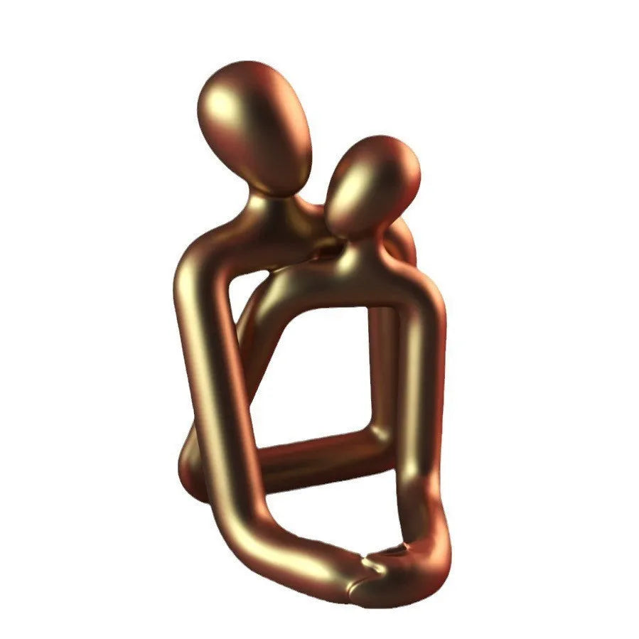 A modern style loving couple resin statue in either milky white or gold finish.
