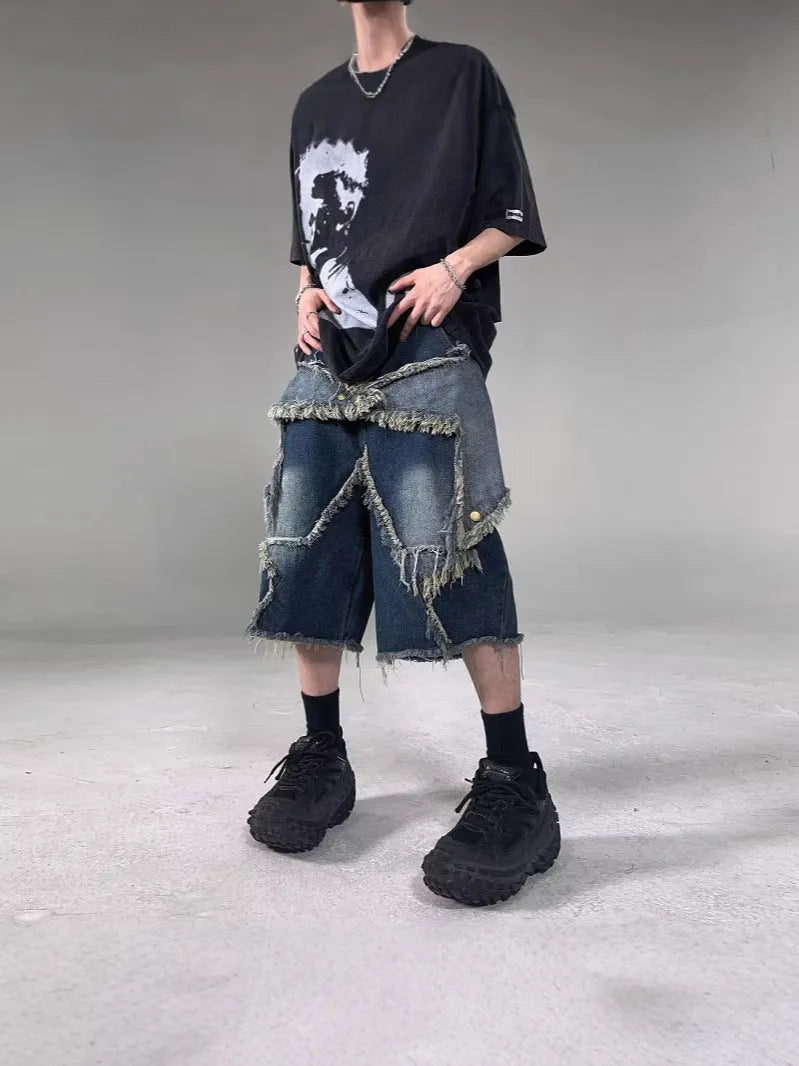 Blue denim shorts with frayed detailing and five-pointed star design in loose fit style