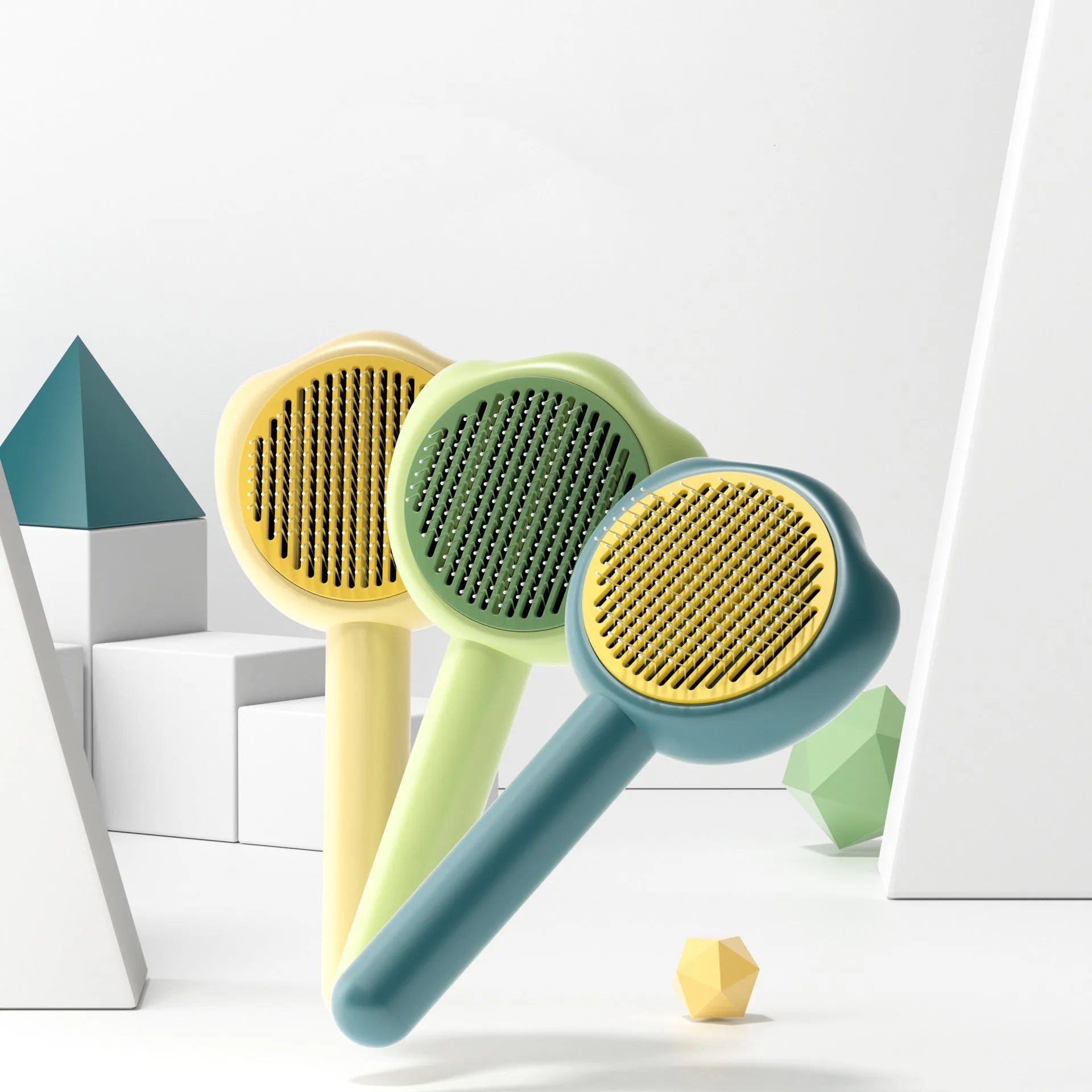 Self-cleaning pet grooming comb in blue, green or yellow for cat brushing and hair removal