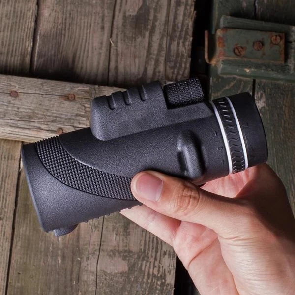 A high-powered 1000X zoom monocular with a 52mm objective lens, waterproof and shockproof design, perfect for outdoor activities like birdwatching, hunting, and hiking.