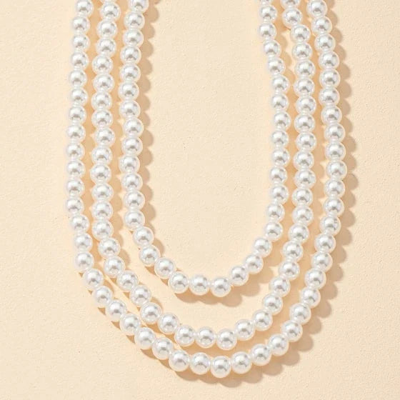 Multilayered pearl necklace with a cascading design, inspired by the fashion trends of the Roaring 20s