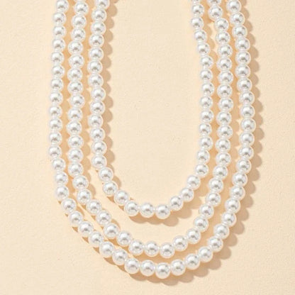 Multilayered pearl necklace with a cascading design, inspired by the fashion trends of the Roaring 20s