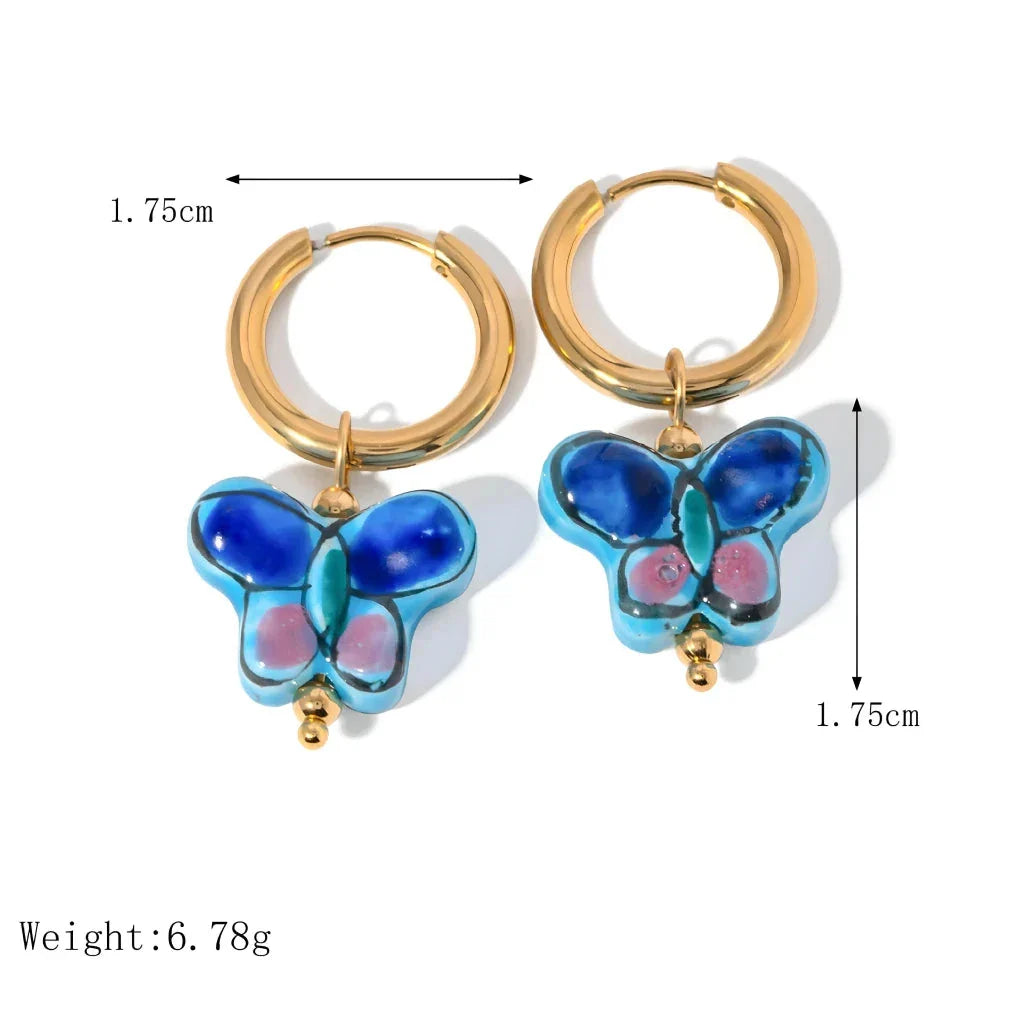 Premium 18K gold plated stainless steel blue flower and butterfly ceramic stud earrings, a stylish accessory crafted in New Zealand