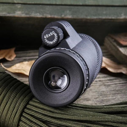 A high-powered 1000X zoom monocular with a 52mm objective lens, waterproof and shockproof design, perfect for outdoor activities like birdwatching, hunting, and hiking.