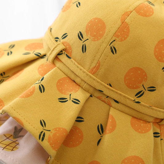 Adorable fruit print cotton bucket hat for baby girls with adjustable bow tie and windproof elastic