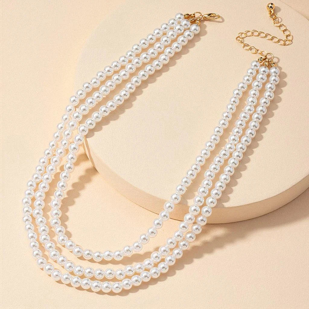 Multilayered pearl necklace with a cascading design, inspired by the fashion trends of the Roaring 20s