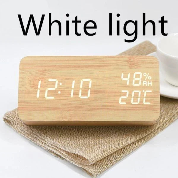 Versatile wooden alarm clock with humidity sensor and silent mode for baby's nursery