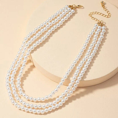 Multilayered pearl necklace with a cascading design, inspired by the fashion trends of the Roaring 20s