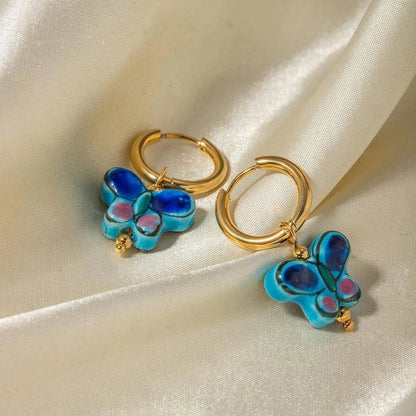 Premium 18K gold plated stainless steel blue flower and butterfly ceramic stud earrings, a stylish accessory crafted in New Zealand