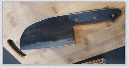 Serbian high-carbon steel chef knife with a razor-sharp edge, perfect for a wide range of cutting tasks in the Kiwi kitchen.