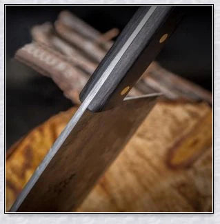 Serbian high-carbon steel chef knife with a razor-sharp edge, perfect for a wide range of cutting tasks in the Kiwi kitchen.